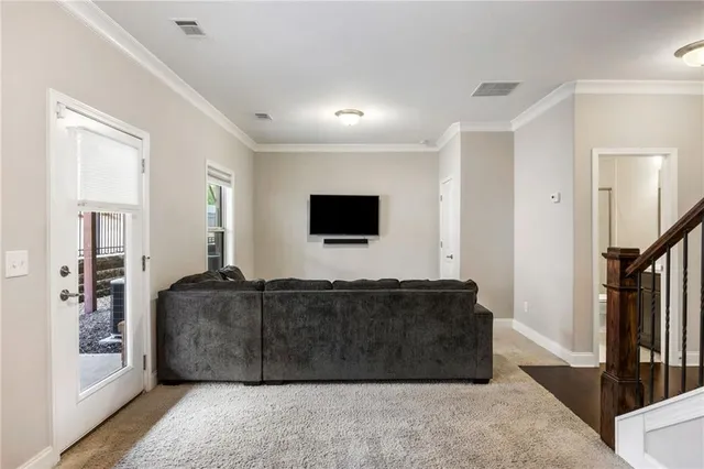 a living room with a couch and a flat screen tv