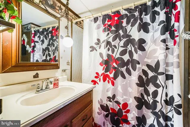 a bedroom with bed and a window