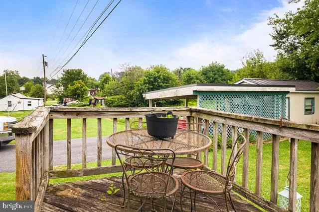 a house view with swimming pool in front of it