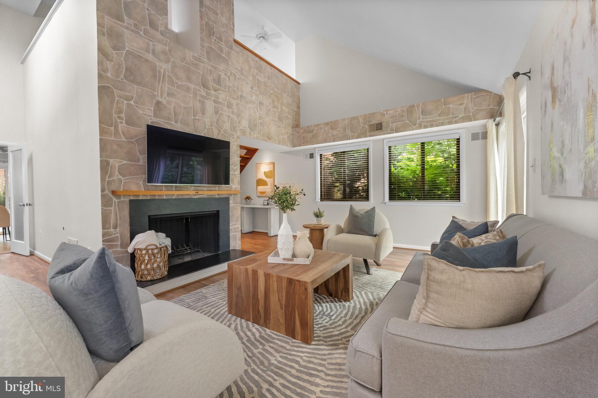 11303 Harborside Cluster Reston, VA 20191 - Photo 11 of 30 a living room with furniture and a fireplace