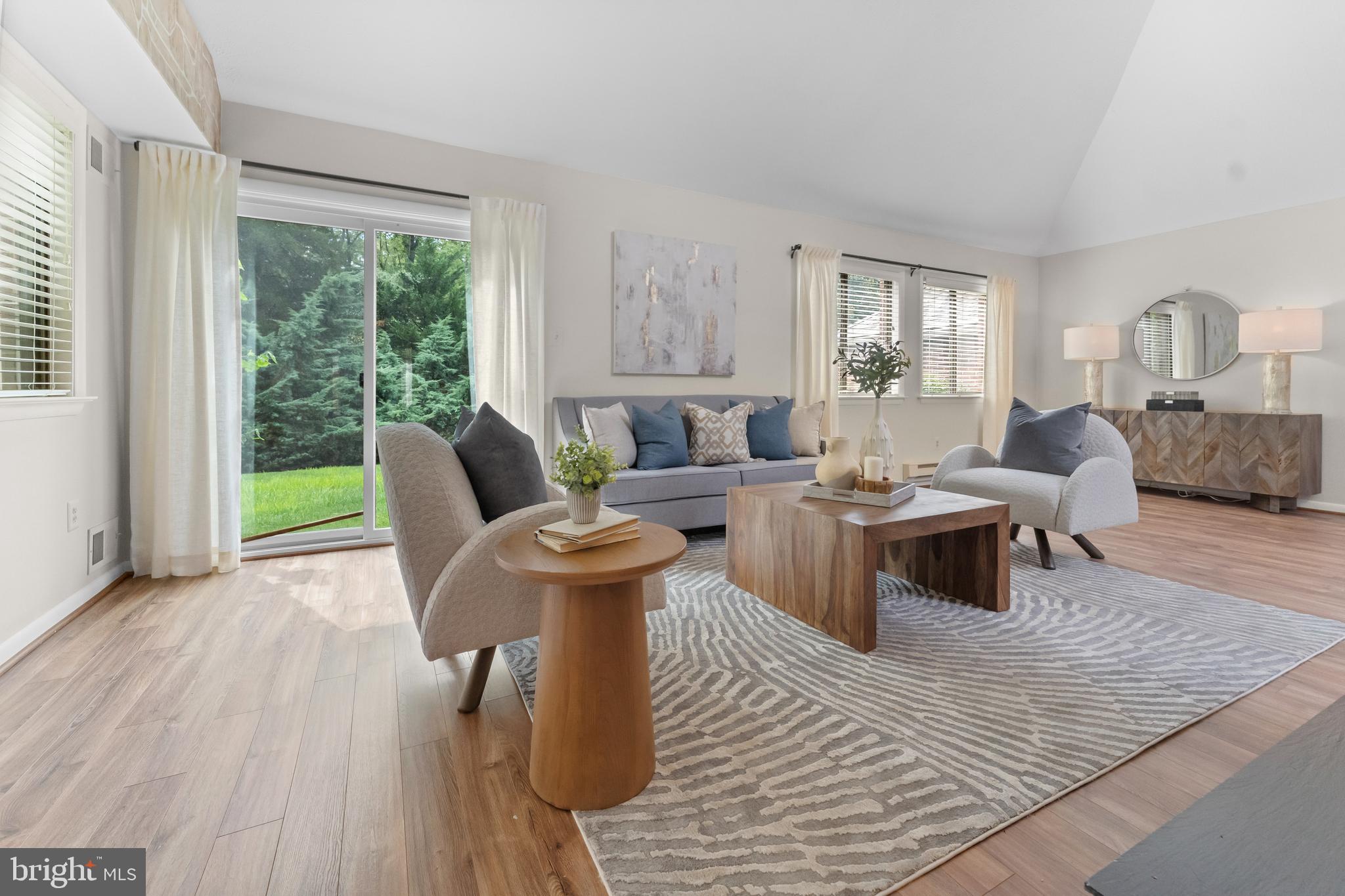 11303 Harborside Cluster Reston, VA 20191 - Photo 13 of 30 a living room with furniture and a large window