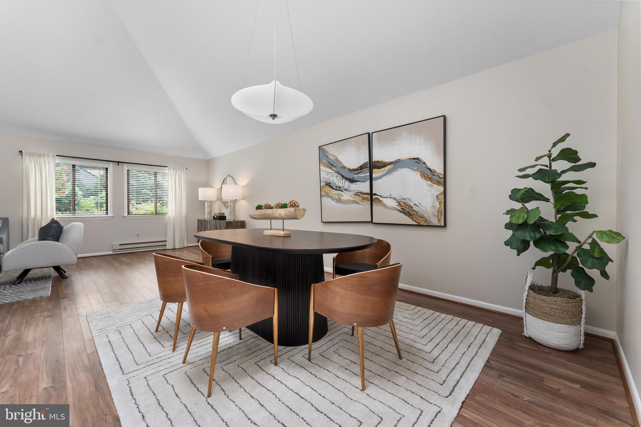 11303 Harborside Cluster Reston, VA 20191 - Photo 19 of 30 a living room with furniture and a potted plant