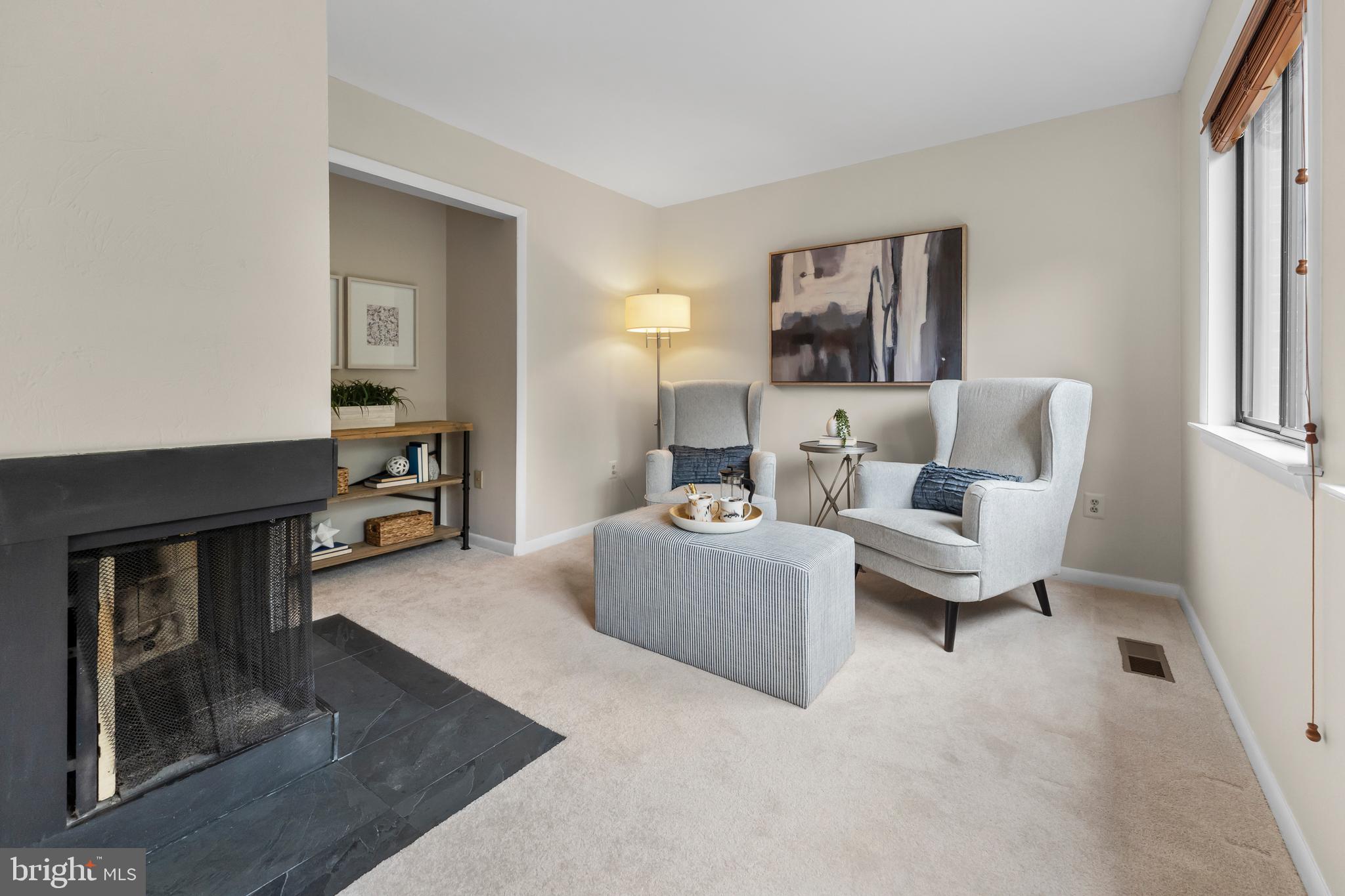 11303 Harborside Cluster Reston, VA 20191 - Photo 25 of 30 a living room with furniture and a fireplace