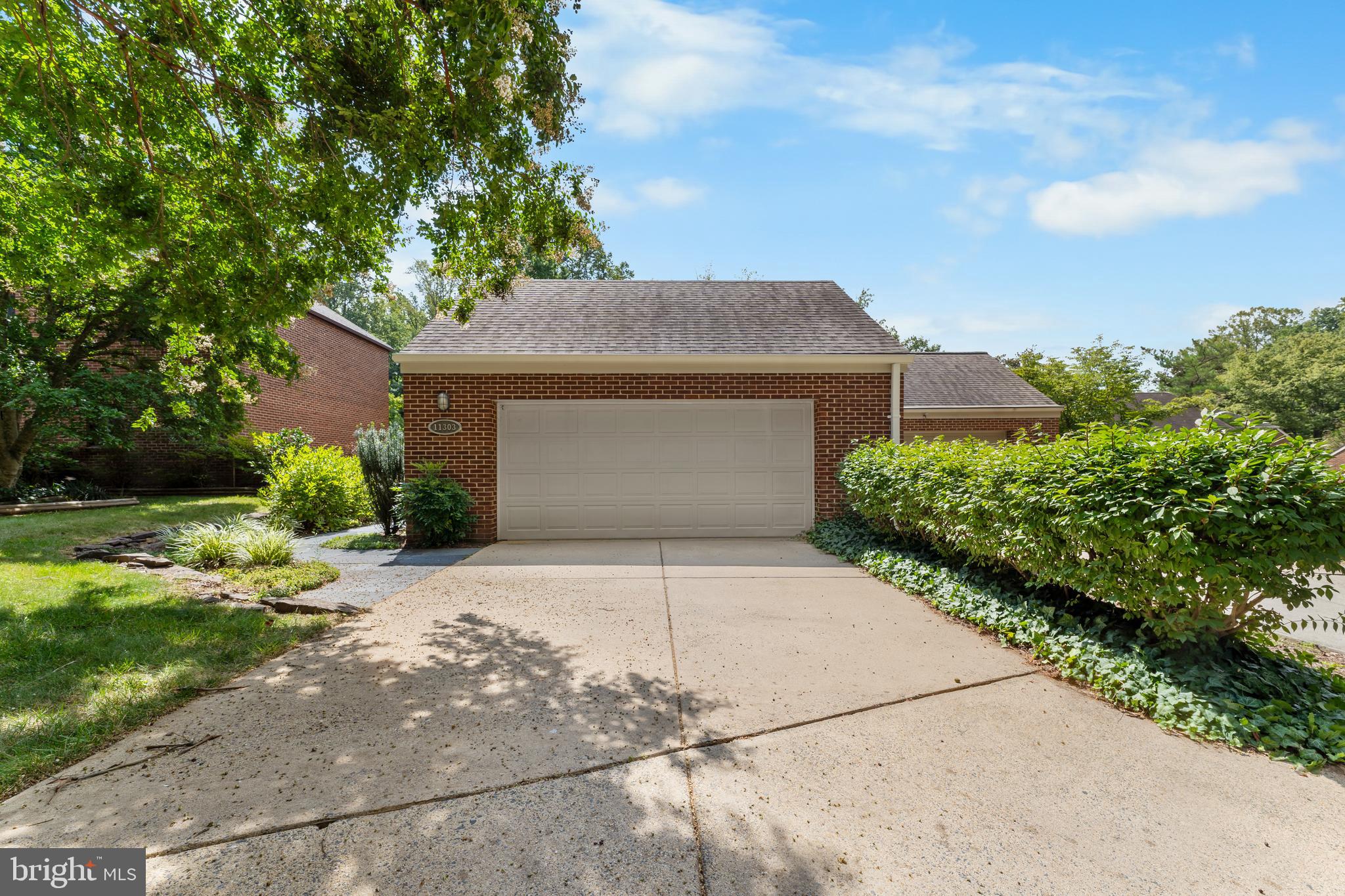 11303 Harborside Cluster Reston, VA 20191 - Photo 3 of 30 a front view of a house with a yard
