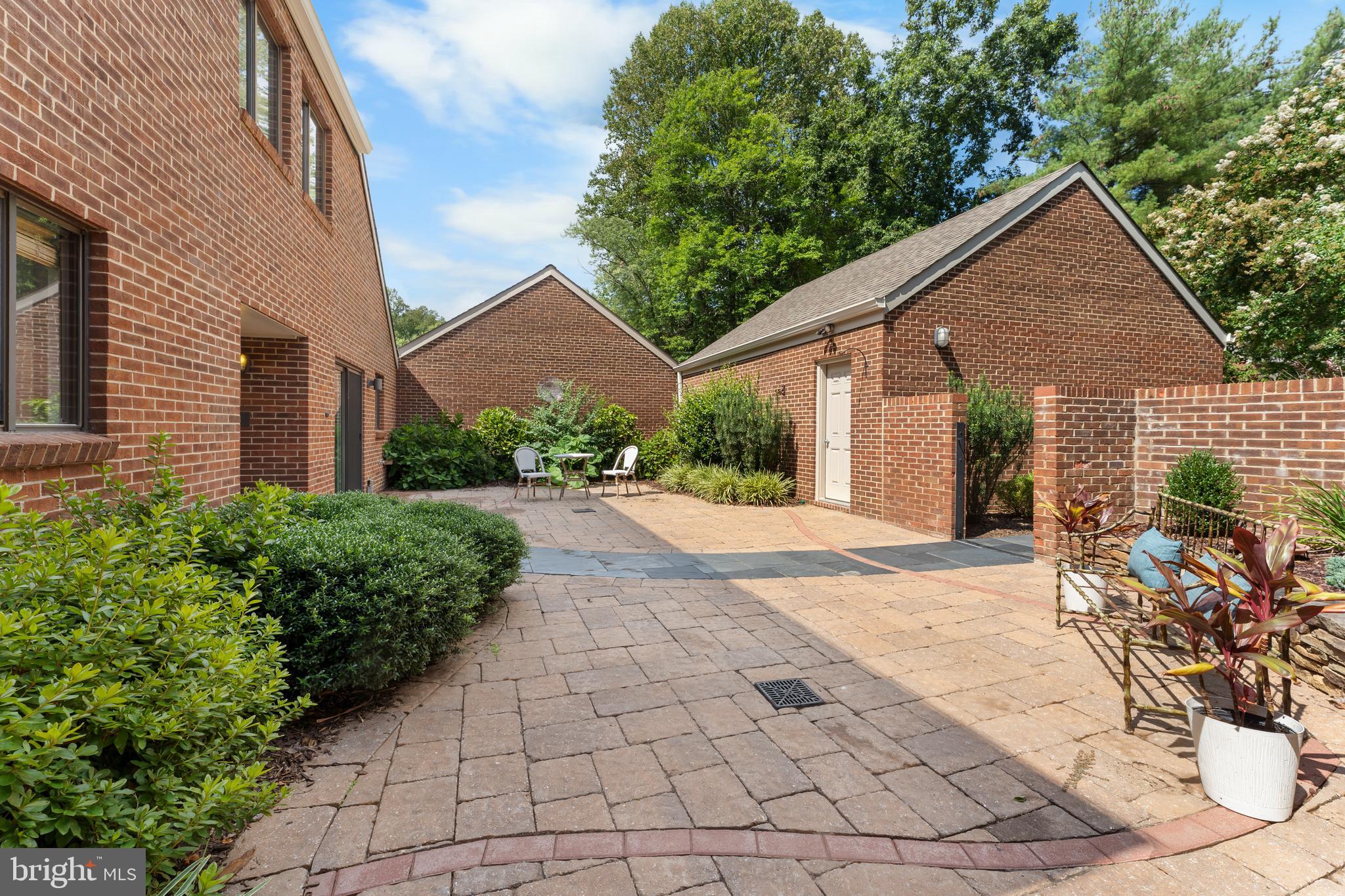 11303 Harborside Cluster Reston, VA 20191 - Photo 4 of 30 a view of a house with a yard and potted plants
