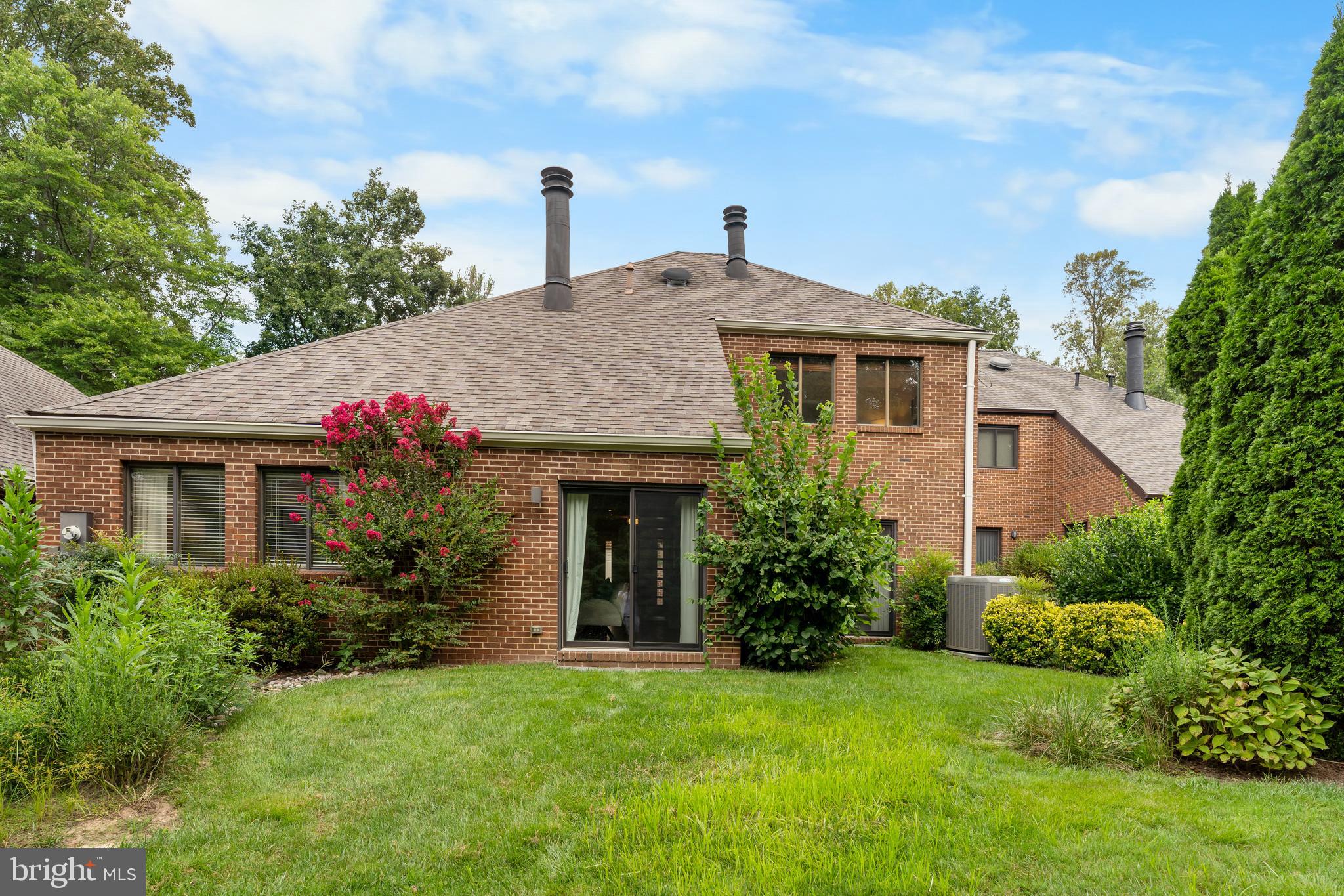 11303 Harborside Cluster Reston, VA 20191 - Photo 5 of 30 a front view of a house with a yard