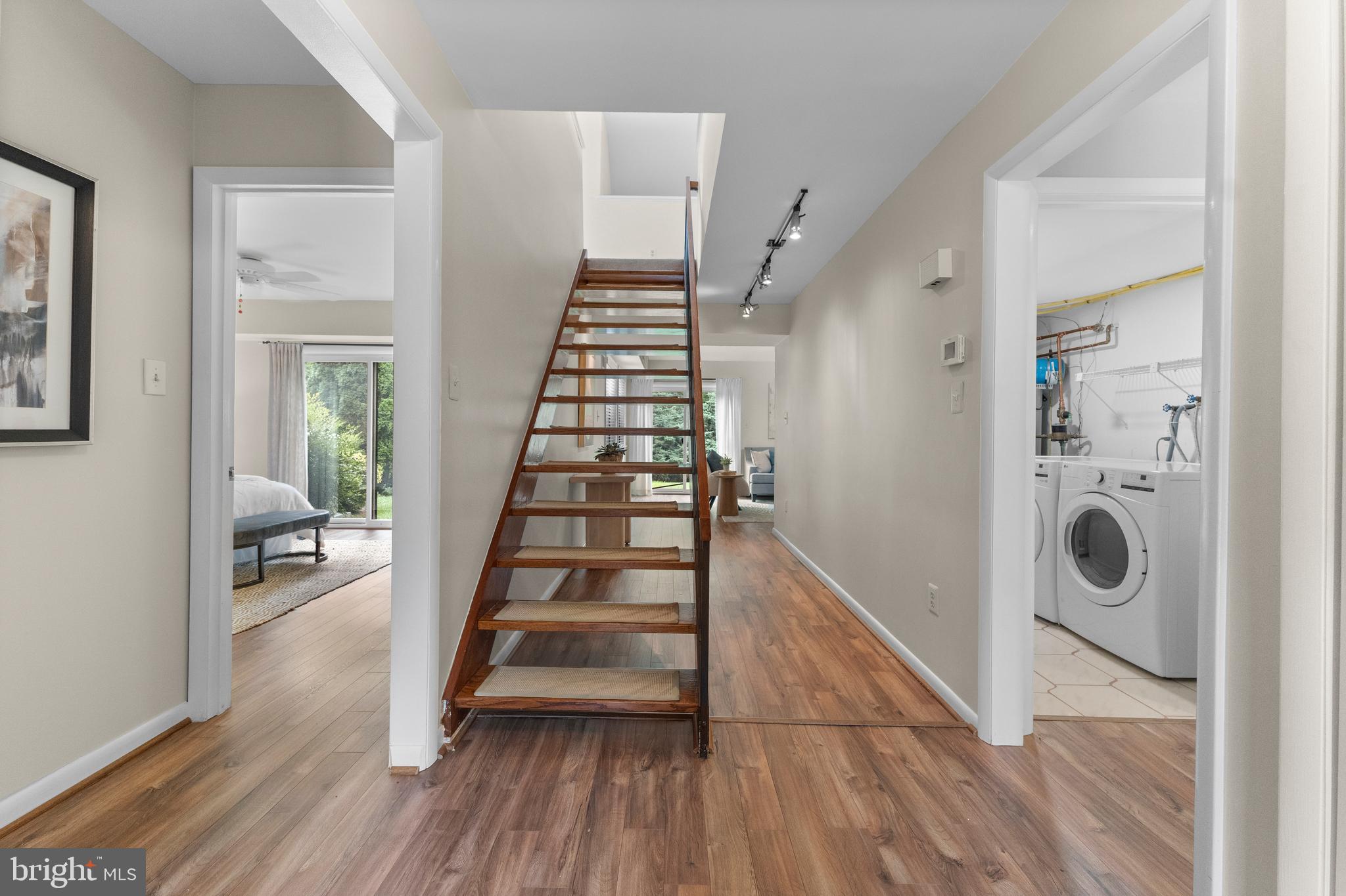 11303 Harborside Cluster Reston, VA 20191 - Photo 8 of 30 a view of a hallway with wooden floor and entryway