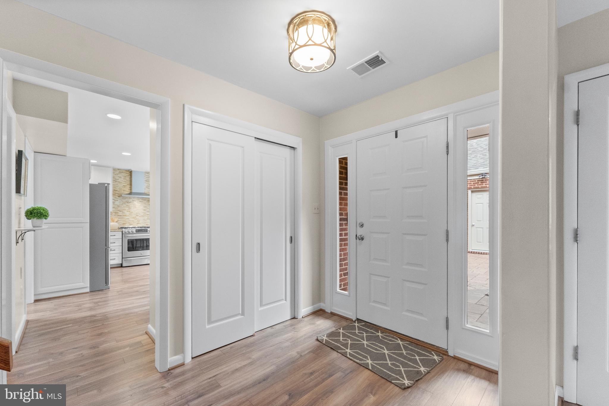 11303 Harborside Cluster Reston, VA 20191 - Photo 9 of 30 a view of an empty room and wooden floor