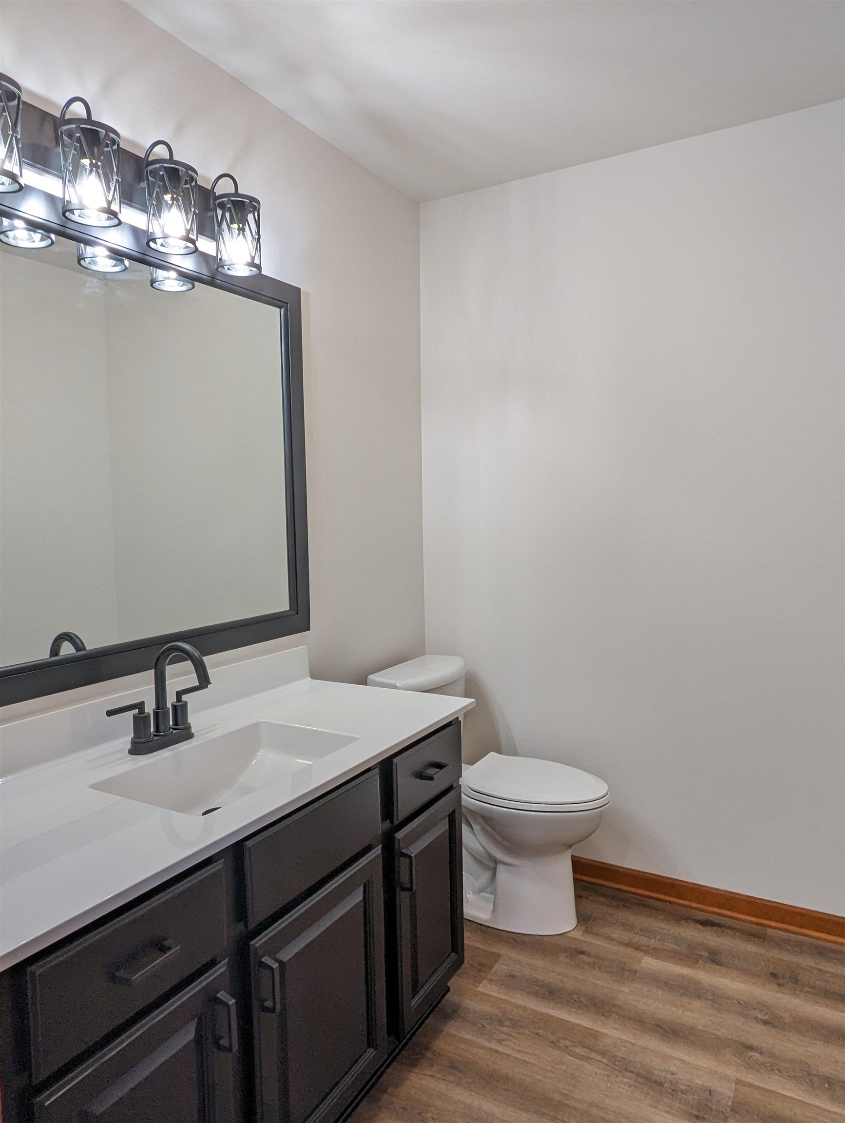 8712 East Kelley Road German Valley, IL 61039 - Photo 11 of 34 a bathroom with a sink a toilet and mirror