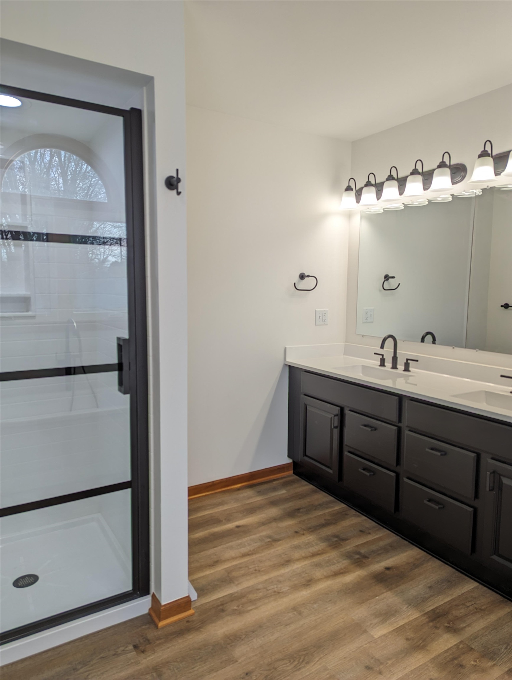 8712 East Kelley Road German Valley, IL 61039 - Photo 14 of 34 a spacious bathroom with a double vanity sink and a mirror