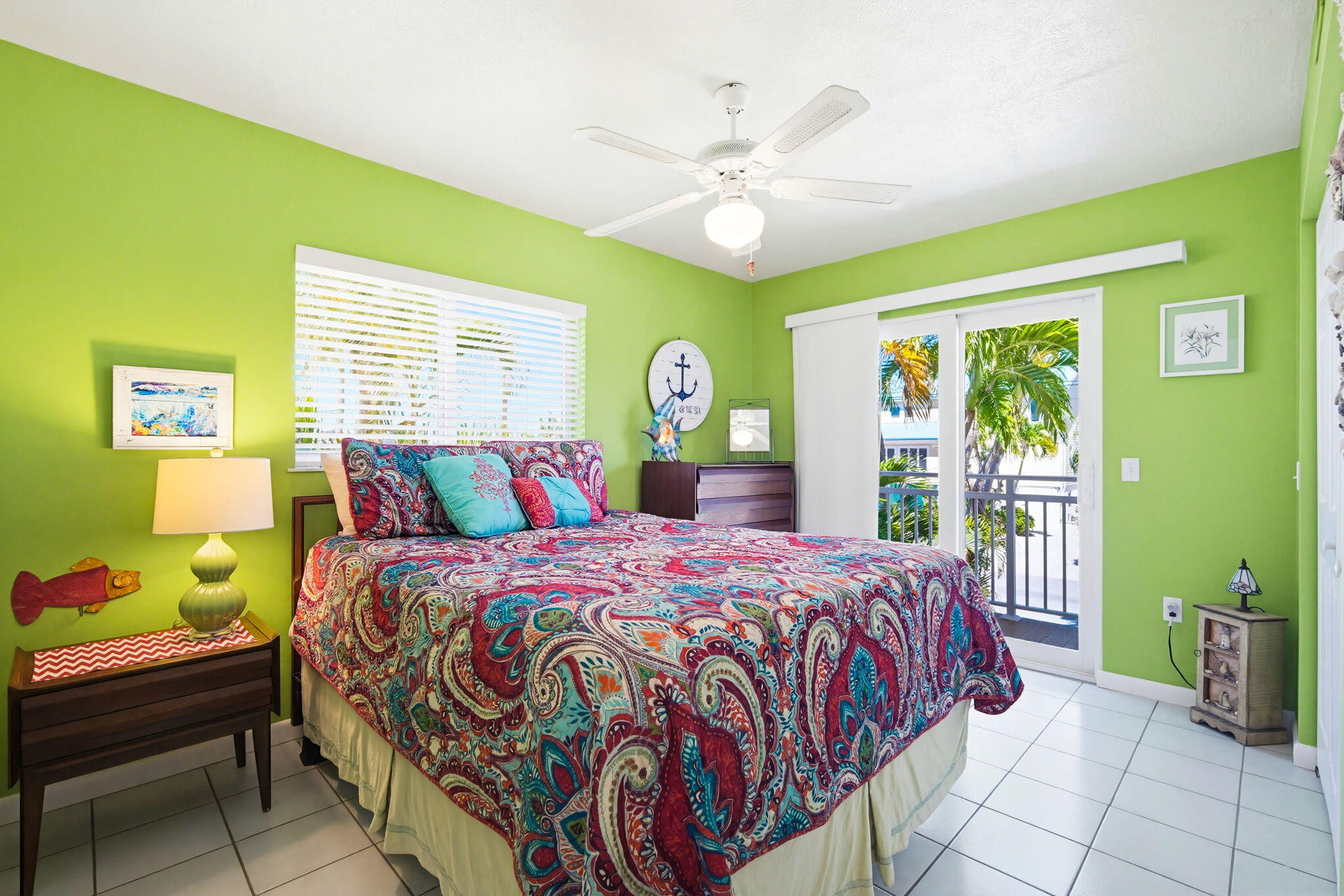 612 Blackbeard Road Summerland Key, FL 33042 - Photo 23 of 68 a bedroom with a bed and a chandelier