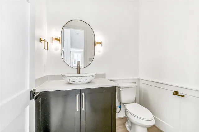 a bedroom with a large bed and a flat screen tv