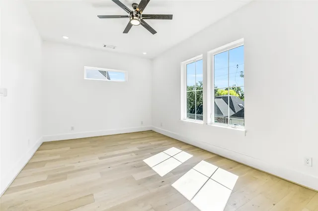 a view of a livingroom with furniture and a table wooden floor