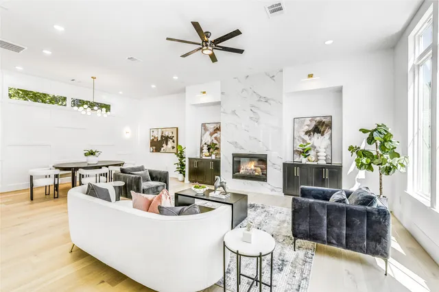 a living room with furniture and fireplace