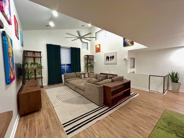 a living room with hard wood flooring and a wooden floor