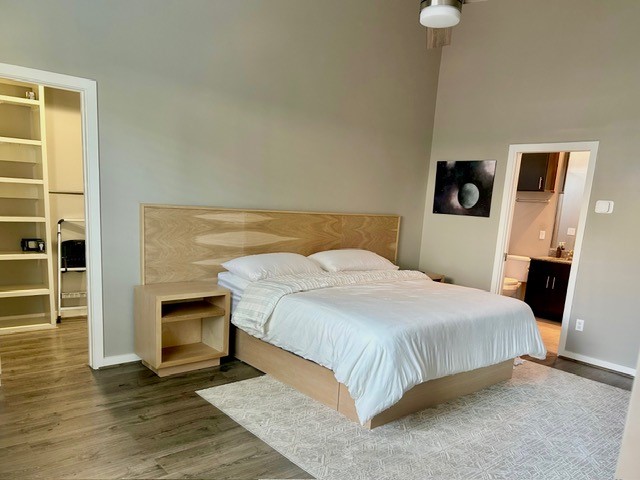 3010 Commerce Street Houston, TX 77003 - Photo 4 of 10 a bedroom with a bed and a television