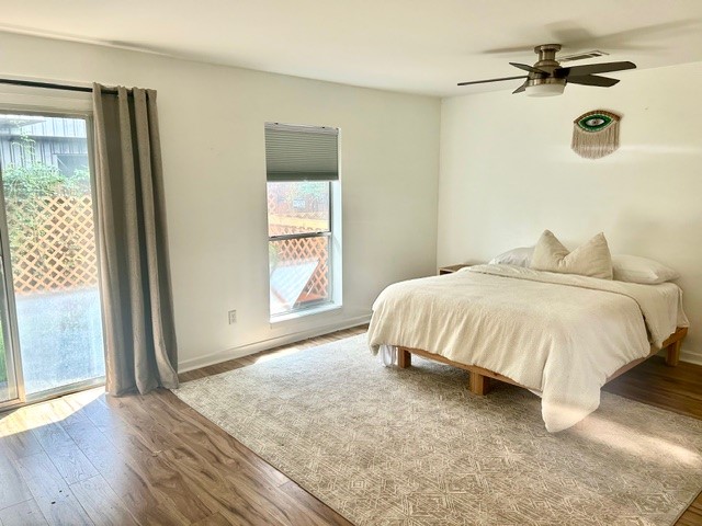 3010 Commerce Street Houston, TX 77003 - Photo 5 of 10 a spacious bedroom with a bed and a window
