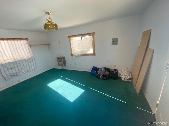4019 Buffalo Ridge Road Como, CO 80432 - Photo 33 of 46 a view of an empty room with a fireplace and a window