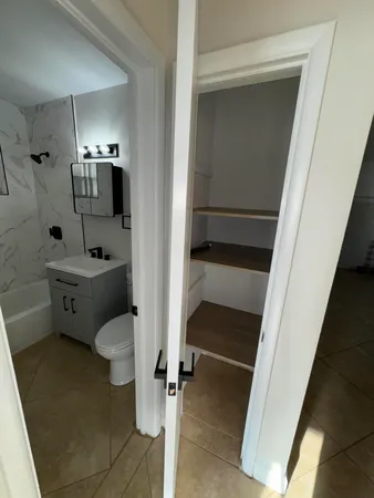a bathroom with a bathtub and a shower