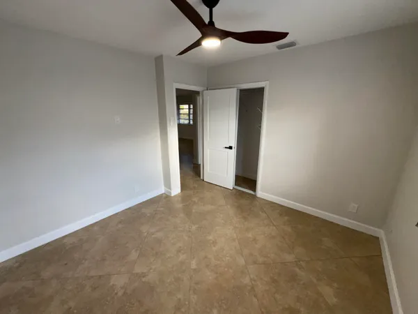 a view of an empty room with a sliding door