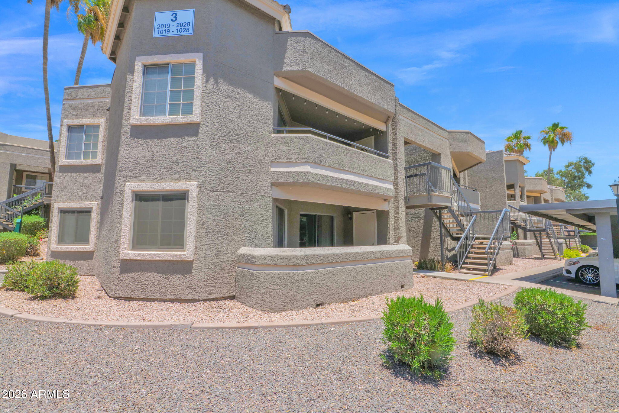 1720 East Thunderbird Road, Unit 1019 Phoenix, AZ 85022 - Photo 2 of 47 a front view of a house with garden