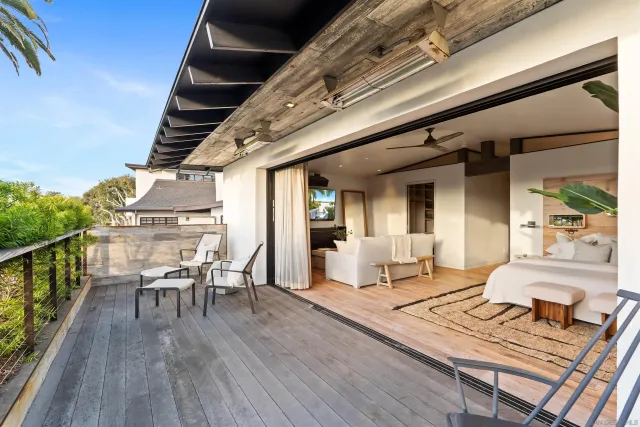 a bathroom with a sink a toilet a mirror and shower