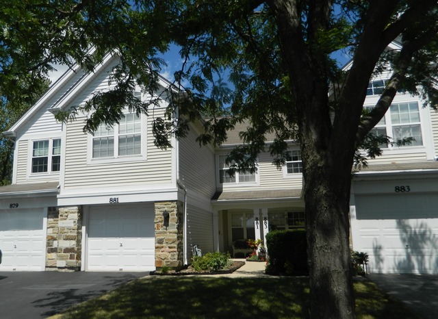 881 Brompton Court Carol Stream, IL 60188 - Photo 1 of 19 a front view of a house with a garden and trees