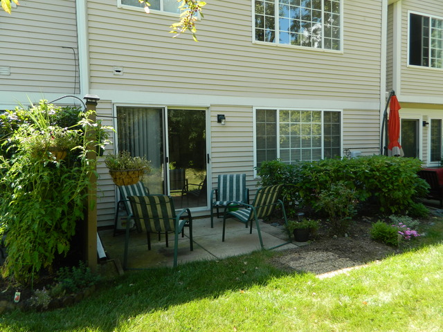 881 Brompton Court Carol Stream, IL 60188 - Photo 18 of 19 a view of a chair and table in backyard of the house