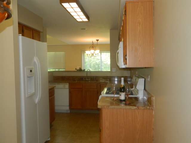 881 Brompton Court Carol Stream, IL 60188 - Photo 7 of 19 a kitchen with stainless steel appliances granite countertop a sink a stove and a refrigerator