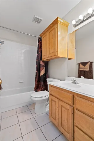 a bathroom with a sink a toilet and bathtub