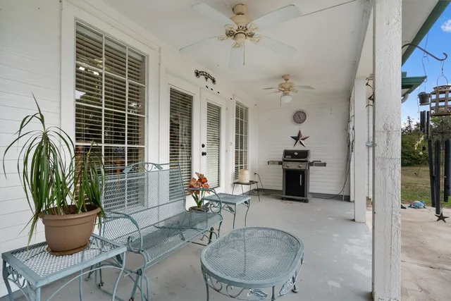 a dining room with furniture and window