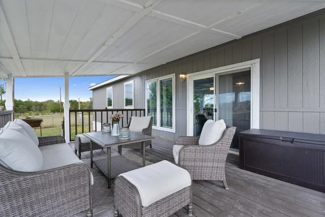 a balcony with furniture and garden