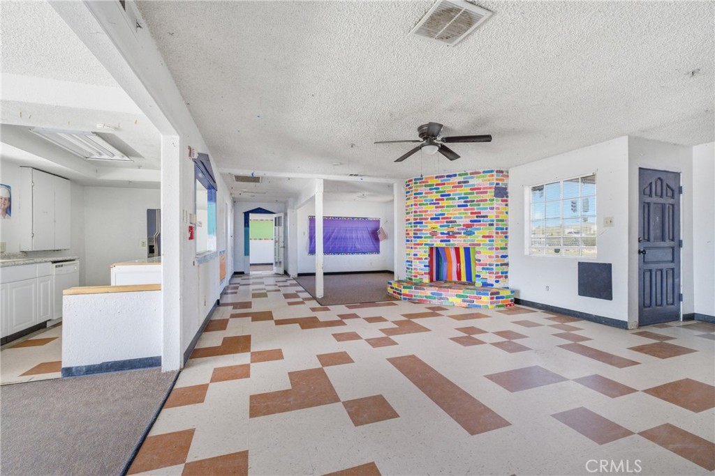 15637 Tuscola Road Apple Valley, CA 92307 - Photo 15 of 57 a view of a hallway with windows