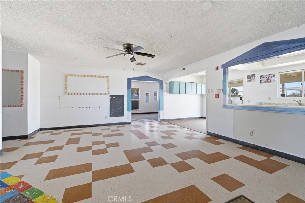 15637 Tuscola Road Apple Valley, CA 92307 - Photo 17 of 57 a view of a bedroom with a bed and wooden floor