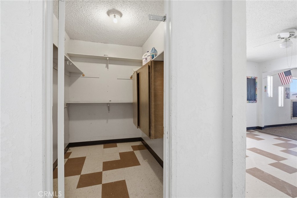 15637 Tuscola Road Apple Valley, CA 92307 - Photo 29 of 57 a view of walk in closet with window