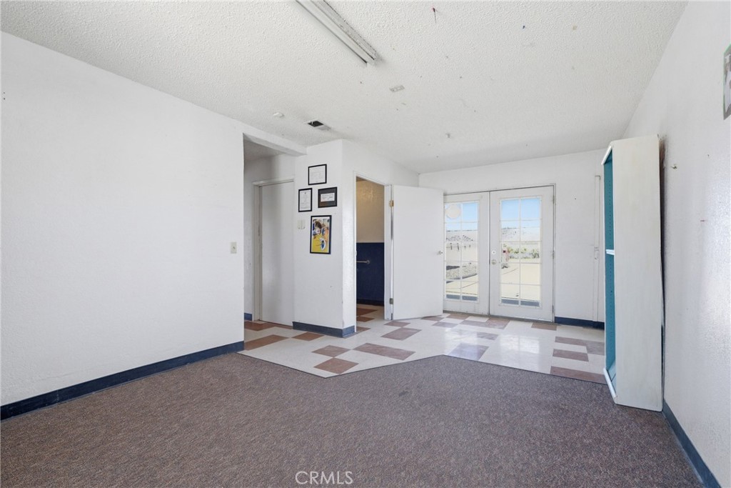 15637 Tuscola Road Apple Valley, CA 92307 - Photo 30 of 57 a view of an empty room with closet and window