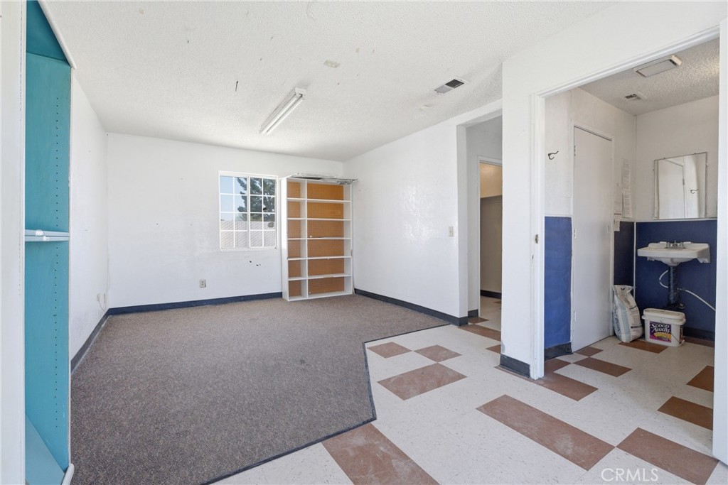 15637 Tuscola Road Apple Valley, CA 92307 - Photo 31 of 57 a view of a livingroom with furniture and an empty room