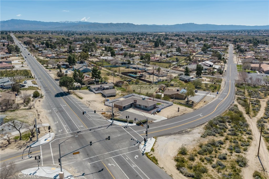 15637 Tuscola Road Apple Valley, CA 92307 - Photo 49 of 57 an aerial view of residential houses with outdoor space