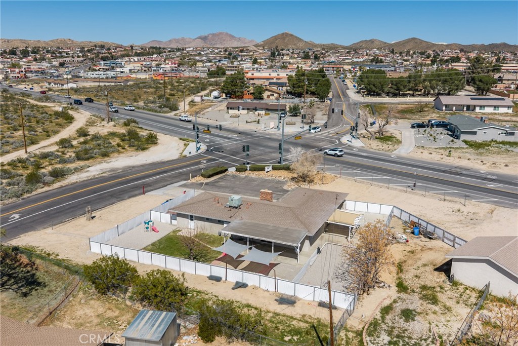 15637 Tuscola Road Apple Valley, CA 92307 - Photo 5 of 57 an aerial view of residential houses with outdoor space