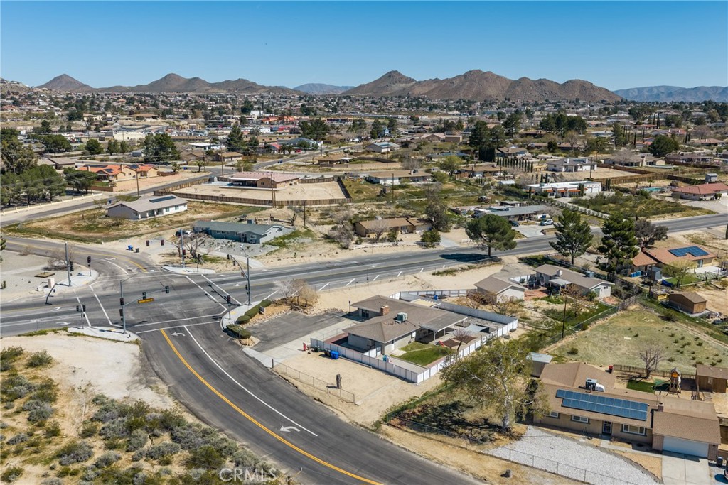 15637 Tuscola Road Apple Valley, CA 92307 - Photo 6 of 57 an aerial view of residential houses with outdoor space