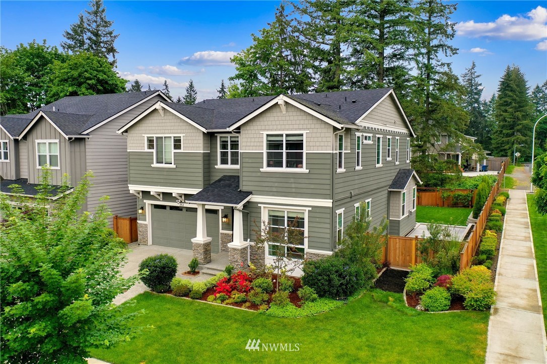 253 Field Place Southeast Renton, WA 98059 - Photo 2 of 40 a front view of a house with garden