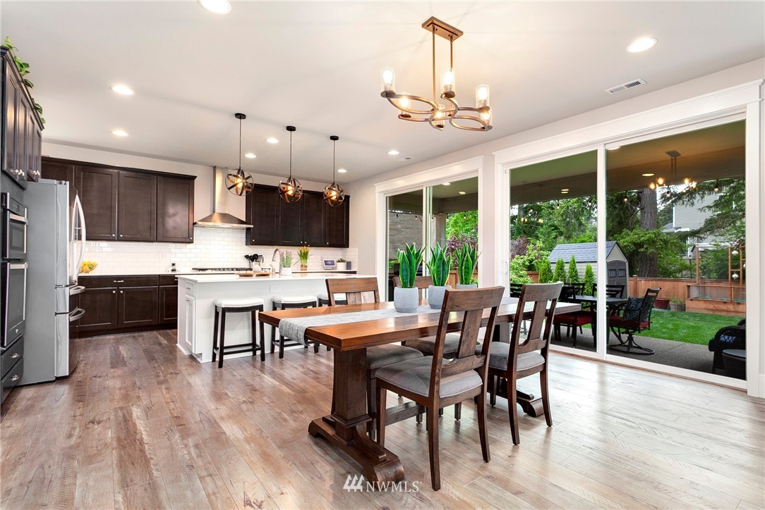 253 Field Place Southeast Renton, WA 98059 - Photo 12 of 40 a view of a dining room with furniture window and wooden floor