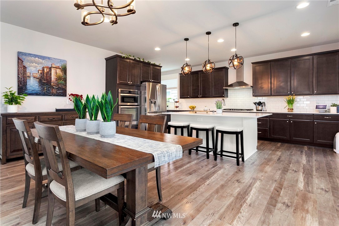 253 Field Place Southeast Renton, WA 98059 - Photo 13 of 40 a large kitchen with a table and chairs