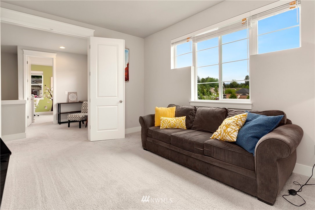 253 Field Place Southeast Renton, WA 98059 - Photo 25 of 40 a living room with furniture and a large window