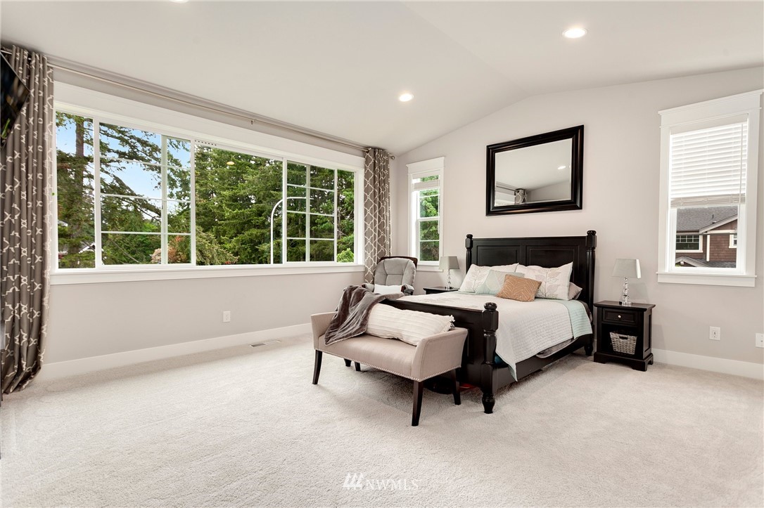 253 Field Place Southeast Renton, WA 98059 - Photo 26 of 40 a spacious bedroom with a bed and a large window