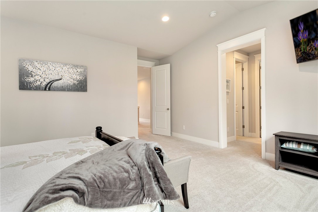 253 Field Place Southeast Renton, WA 98059 - Photo 28 of 40 a bedroom with a bed and a tv