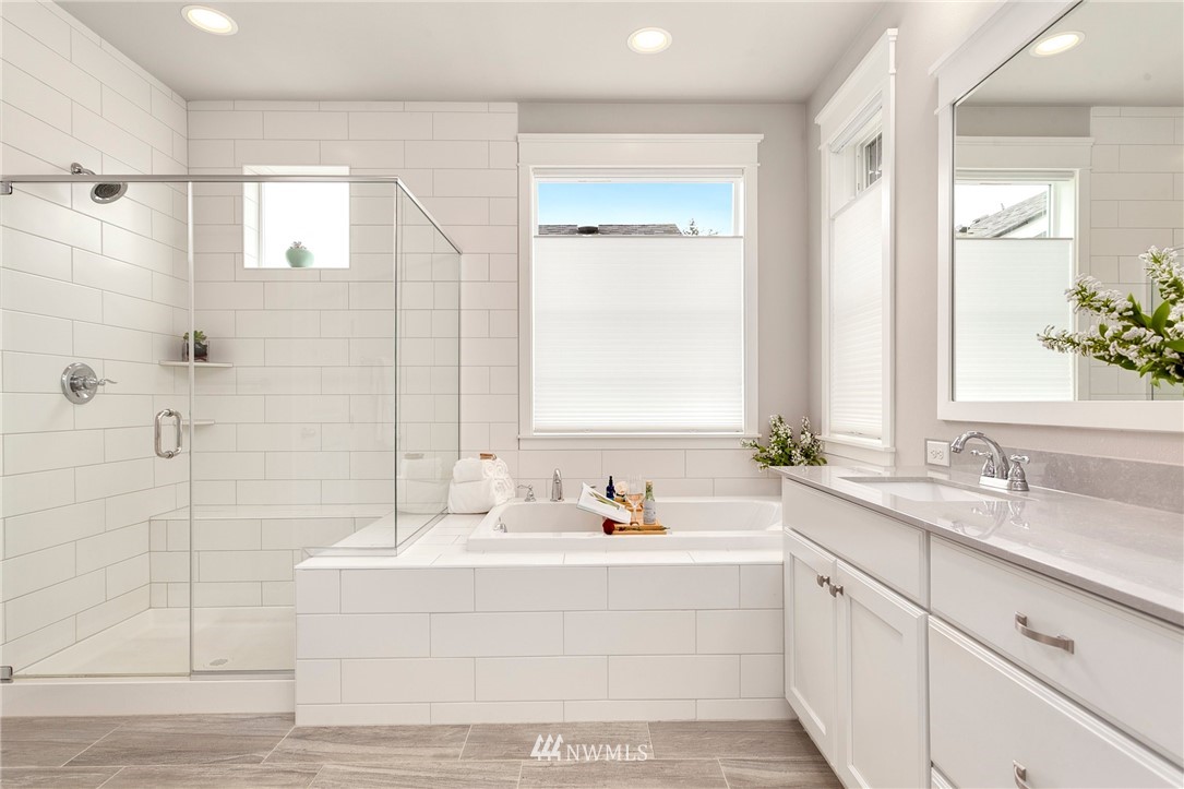 253 Field Place Southeast Renton, WA 98059 - Photo 30 of 40 a bathroom with a bathtub a sink and a window