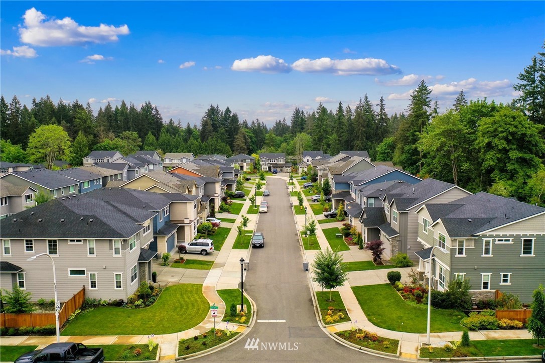 253 Field Place Southeast Renton, WA 98059 - Photo 4 of 40 a aerial view of multiple houses with yard