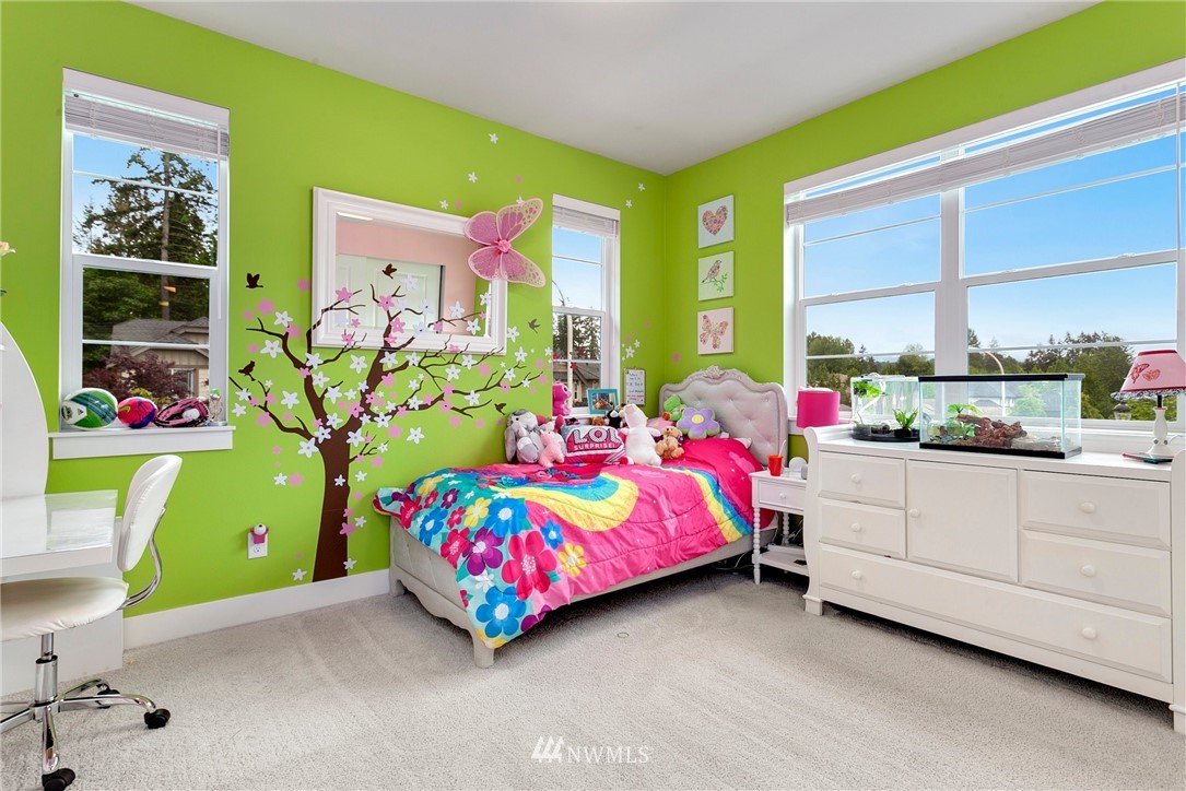 253 Field Place Southeast Renton, WA 98059 - Photo 34 of 40 a bedroom with pink bed and window