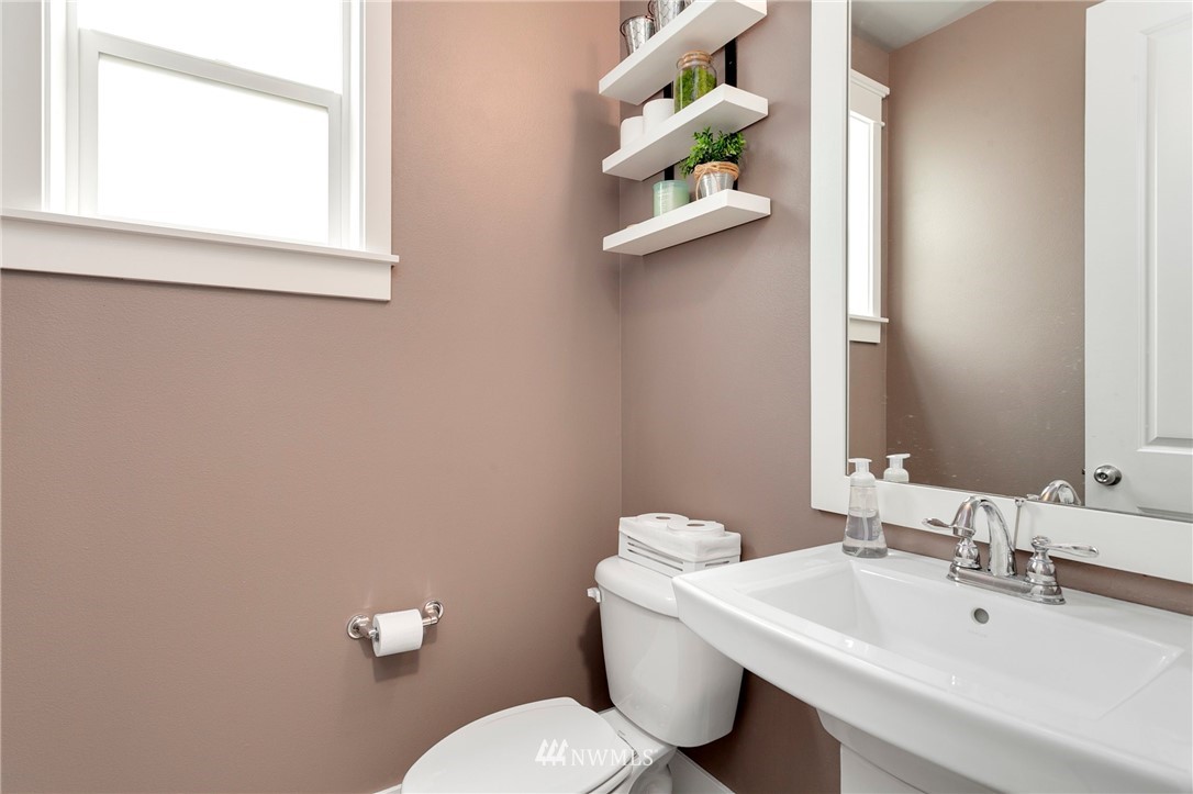 253 Field Place Southeast Renton, WA 98059 - Photo 36 of 40 a bathroom with a sink mirror and toilet